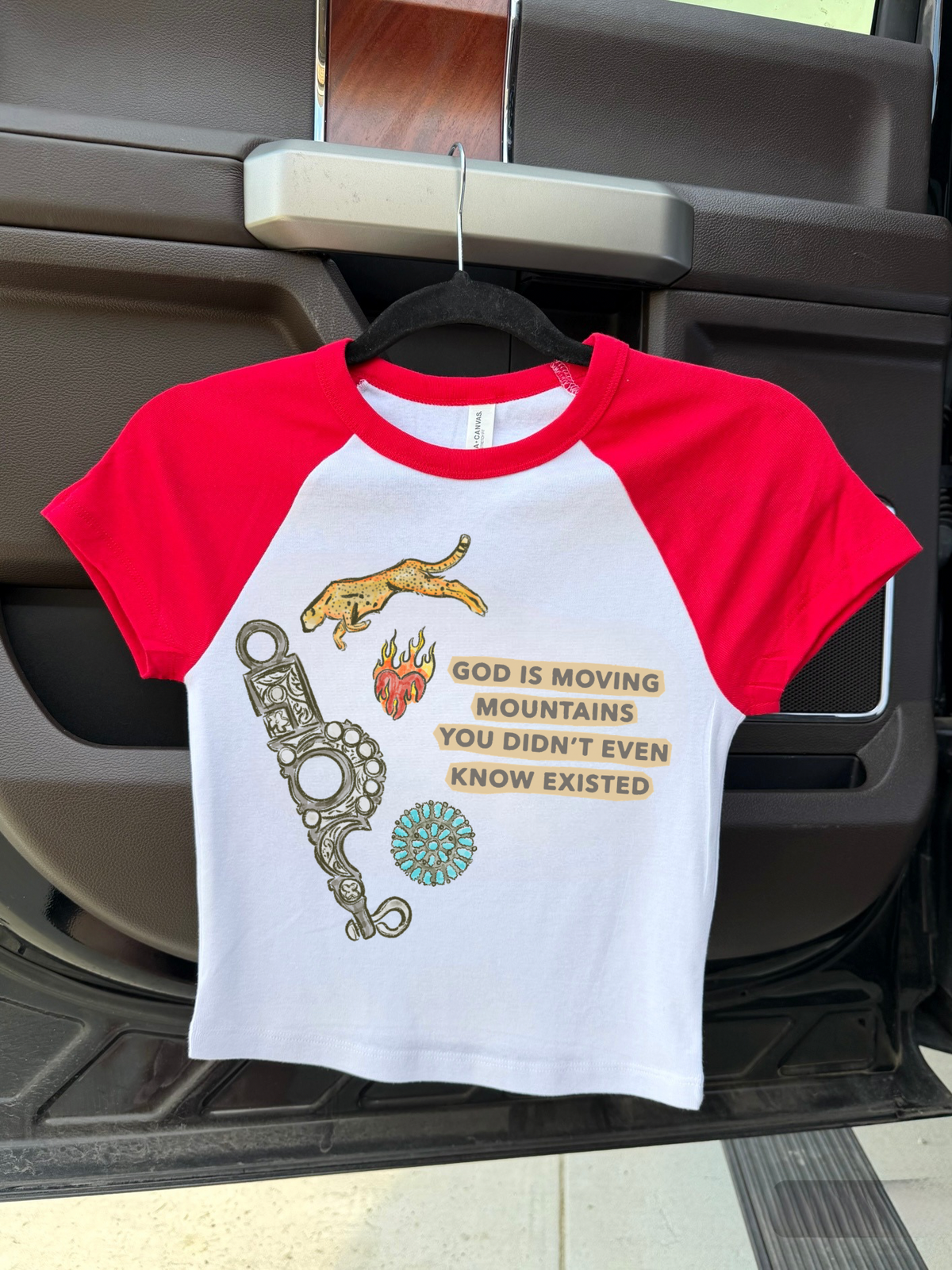 God Is Moving Mountains Baby Tee