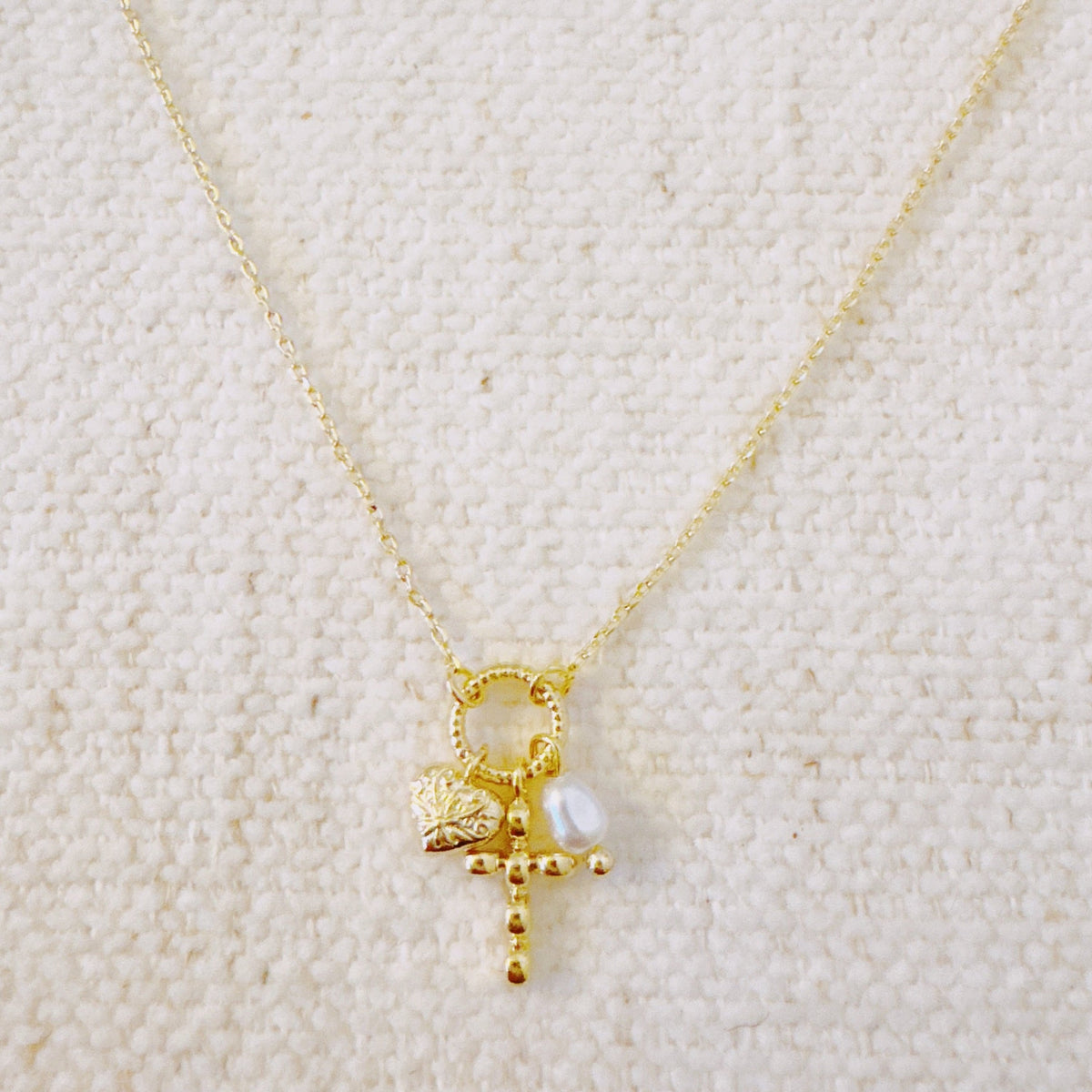 Faith & Love Charm Necklace – Gold-Tone Chain with Heart, Cross, and Pearl Charms
