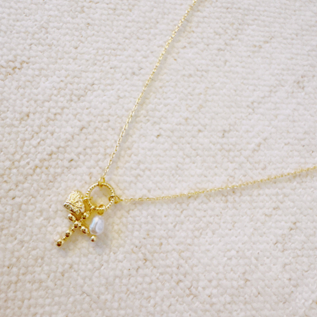 Faith & Love Charm Necklace – Gold-Tone Chain with Heart, Cross, and Pearl Charms
