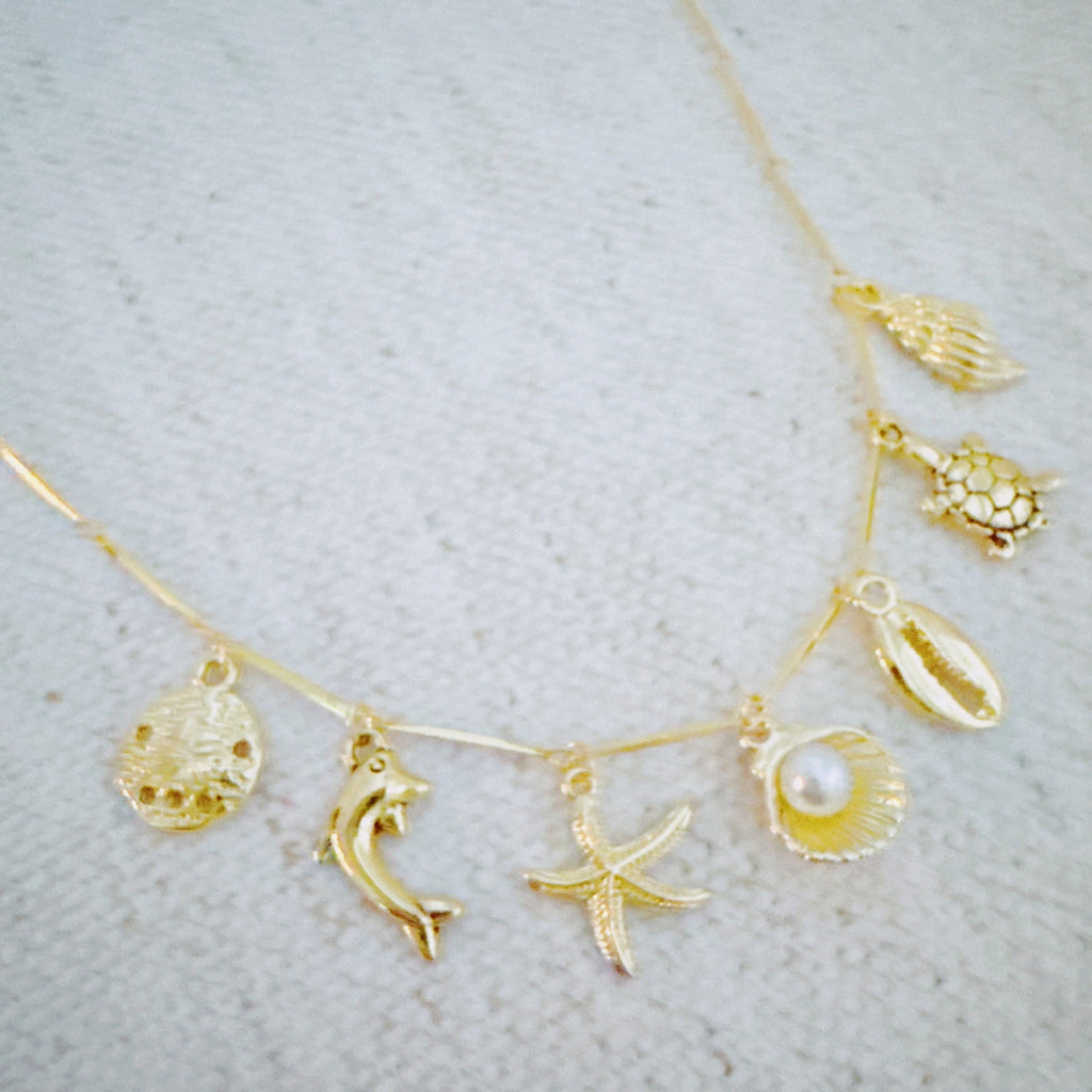 Golden Sea Charm Necklace – Shell, Dolphin & Starfish