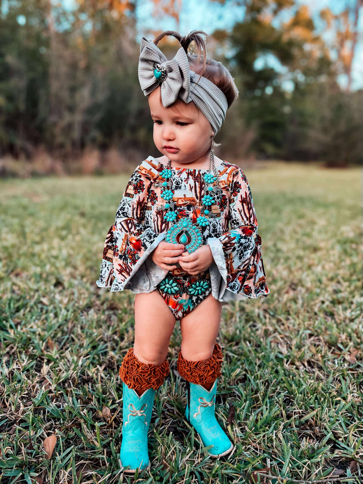 Turquoise Bow Tanner Mark Boots