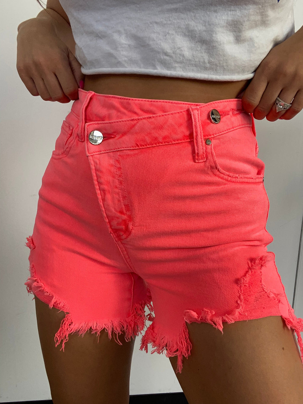 Lindsey Asymmetrical Distressed Shorts- Coral Pink