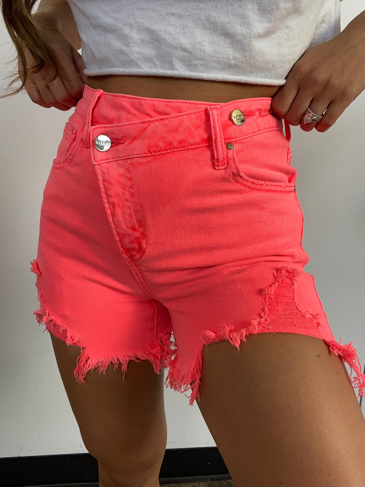 Lindsey Asymmetrical Distressed Shorts- Coral Pink
