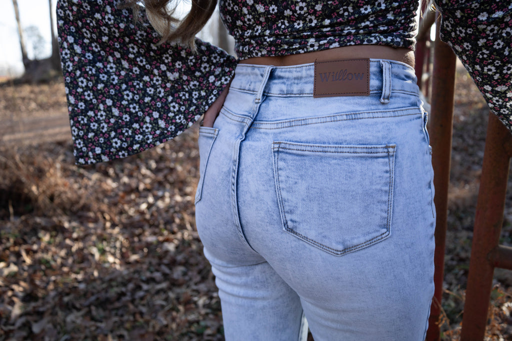 Lucy Asymmetrical Distressed Flare Jeans