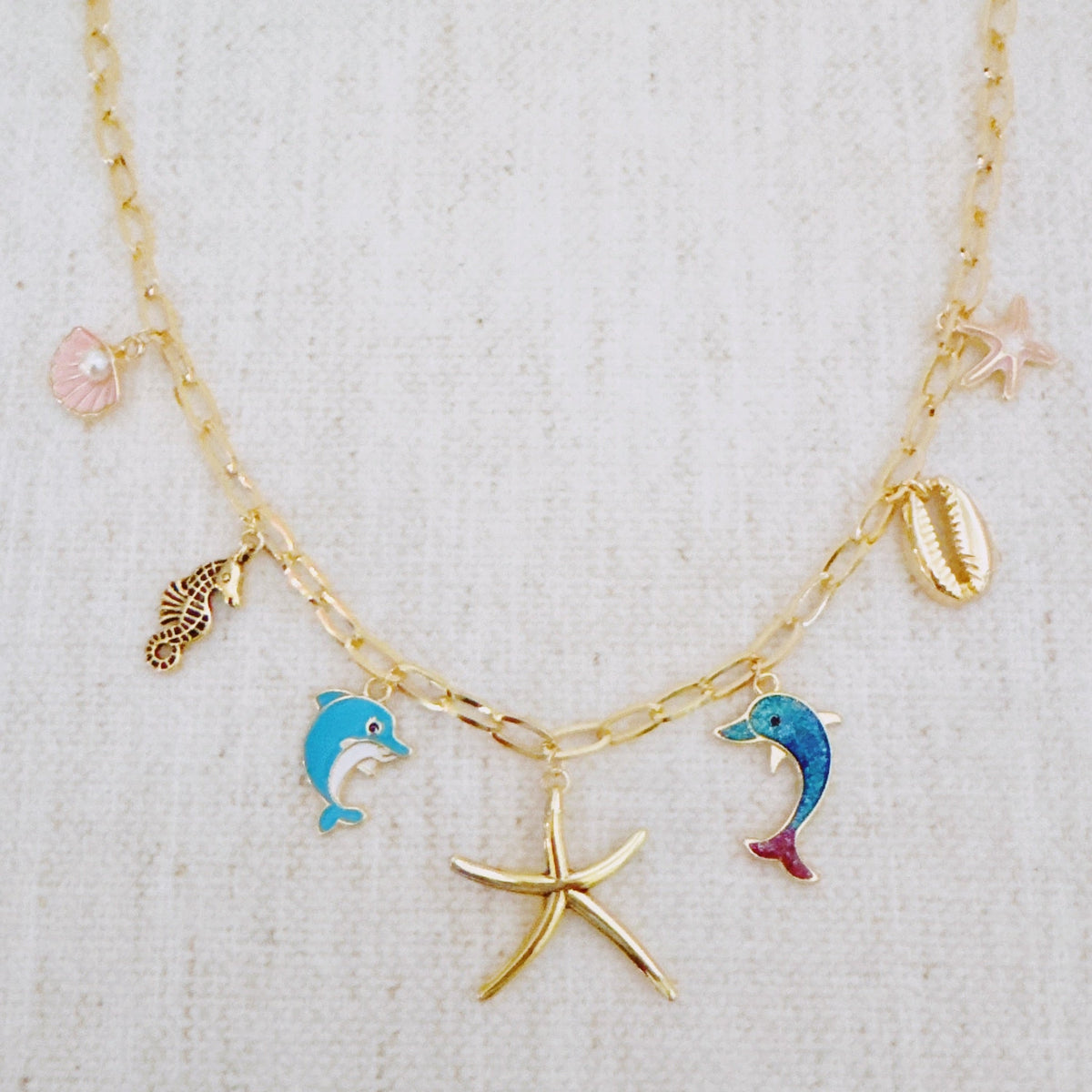 Ocean Play Charm Necklace – Dolphin, Starfish & Shell