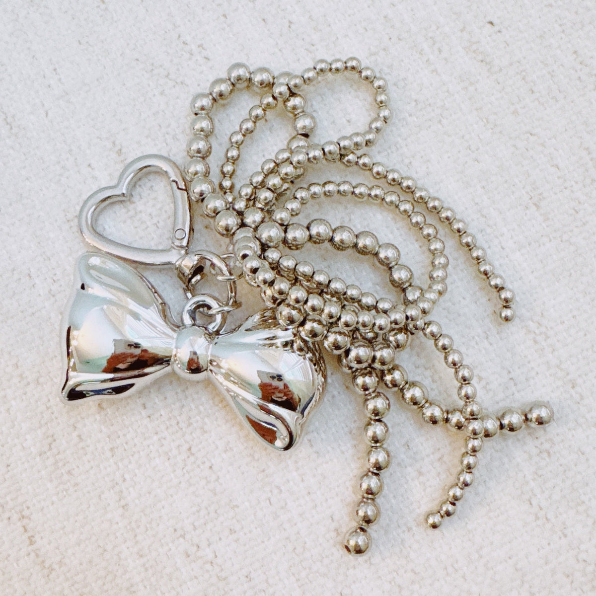 Silver Cascade Bow Charm Bag Charm – Metallic Bow with Beaded Tassels & Bow Loop